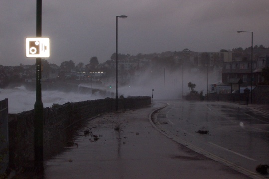 The road at Livermead is completely blocked by waves and debris