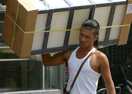Man carrying heavy load