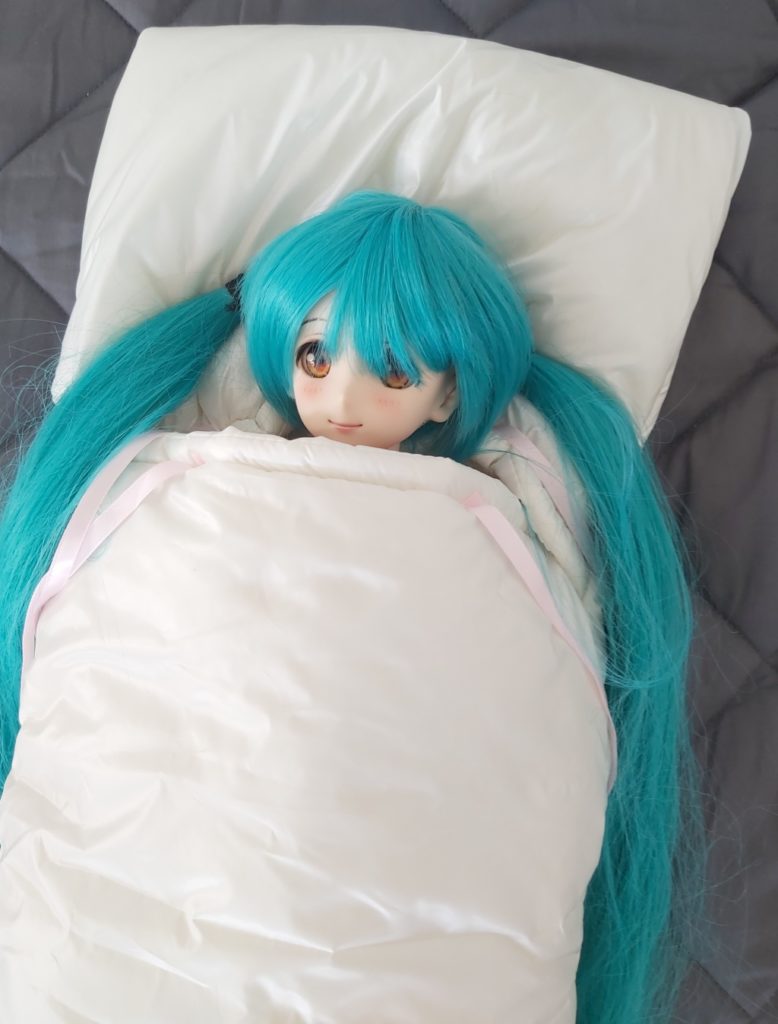 Miku Hatsune BJD sleeping in a protective doll sleeping bag