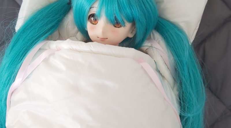 Miku Hatsune BJD sleeping in a protective doll sleeping bag